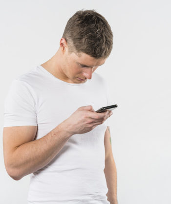 young-man-using-his-mobile-pHONE